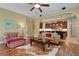 Open-concept living space with kitchen, hardwood floors, and lots of natural light at 2731 Coventry Ave, Lakeland, FL 33803