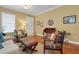 Cozy living area with hardwood floors, a stylish desk, and eclectic décor touches at 2731 Coventry Ave, Lakeland, FL 33803