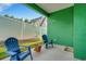 Private outdoor patio perfect for relaxing, with comfortable blue chairs and a charming garden pot at 2731 Coventry Ave, Lakeland, FL 33803