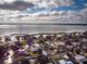 Stunning aerial view of lakefront homes with personal canals surrounded by mature trees and beautiful blue water at 2757 Pine Acres Dr, Lake Wales, FL 33898