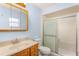 Bathroom with a wood vanity, a shower/tub combo, and a large framed mirror at 2757 Pine Acres Dr, Lake Wales, FL 33898