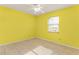 The bright bedroom features tiled floors, a window, and a neutral color scheme at 2757 Pine Acres Dr, Lake Wales, FL 33898