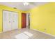 Bright bedroom with tiled floors, a closet, and a classic neutral color scheme at 2757 Pine Acres Dr, Lake Wales, FL 33898