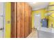 Bright laundry room featuring built-in wooden storage cabinets and a utility sink with shelving at 2757 Pine Acres Dr, Lake Wales, FL 33898