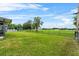 Expansive backyard featuring lush green grass, a fence, and an open view for outdoor enjoyment at 2810 Gary Ln, Lakeland, FL 33812