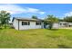 Charming home with a well-kept lawn and a classic white facade, enhancing its curb appeal at 2810 Gary Ln, Lakeland, FL 33812