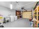Garage featuring washer, dryer, utility sink, storage, and garage door at 2810 Gary Ln, Lakeland, FL 33812