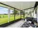 Covered patio includes grill, outdoor furniture, and beautiful outdoor view at 2810 Gary Ln, Lakeland, FL 33812