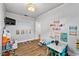 Spacious playroom featuring hardwood floors, television, and toys at 2810 Gary Ln, Lakeland, FL 33812