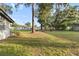 View of expansive backyard with mature trees offering plenty of shade at 2920 Audie Combee Rd, Lakeland, FL 33801