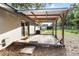 Wooden deck on a light-grey home, with mature trees providing shade at 2920 Audie Combee Rd, Lakeland, FL 33801