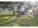 Spacious backyard featuring a covered carport, perfect for parking and storage at 2920 Audie Combee Rd, Lakeland, FL 33801