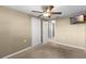 Comfortable bedroom with carpet flooring, ceiling fan, and closet at 2920 Audie Combee Rd, Lakeland, FL 33801
