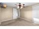 Bedroom featuring a ceiling fan and a carpeted floor at 2920 Audie Combee Rd, Lakeland, FL 33801