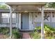 A closer view of the home's front door with the address, welcoming decor and the paved entry way at 2920 Audie Combee Rd, Lakeland, FL 33801