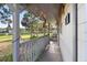 Detailed view of the covered front porch with string lights and decorative accents enhancing the welcoming ambiance at 2920 Audie Combee Rd, Lakeland, FL 33801