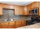 Modern kitchen with sleek countertops, stainless steel appliances, and ample cabinet space at 2920 Audie Combee Rd, Lakeland, FL 33801
