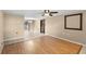 Bright living room with wood laminate flooring and view to outdoor patio at 2920 Audie Combee Rd, Lakeland, FL 33801