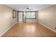 Inviting living room featuring laminate flooring and ample natural light at 2920 Audie Combee Rd, Lakeland, FL 33801