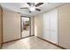 Room featuring tile flooring and an entry to the kitchen at 2920 Audie Combee Rd, Lakeland, FL 33801