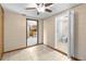 Room featuring tile flooring and entries to the kitchen and bathroom at 2920 Audie Combee Rd, Lakeland, FL 33801