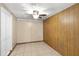 Room featuring tile flooring and wooden wall paneling at 2920 Audie Combee Rd, Lakeland, FL 33801