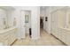 This bathroom offers a double vanity with cabinets and drawers, plus a separate toilet room for added privacy at 2936 Grasslands Dr, Lakeland, FL 33803