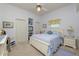 Inviting bedroom with a comfortable bed, white furniture, a ceiling fan, and ample closet space at 2936 Grasslands Dr, Lakeland, FL 33803