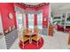 Cozy breakfast nook with a view of the pool, featuring a round table and decorative accents at 2936 Grasslands Dr, Lakeland, FL 33803