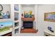 Elegant fireplace with colorful tile surround and custom display shelving at 2936 Grasslands Dr, Lakeland, FL 33803