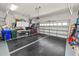 Well-organized garage featuring storage solutions, work area, and secure door for convenience and functionality at 2936 Grasslands Dr, Lakeland, FL 33803