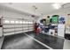 Spacious garage with a secure door, offering ample storage with shelving and room for parking at 2936 Grasslands Dr, Lakeland, FL 33803