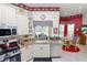 Bright kitchen featuring stainless steel appliances and granite countertops, with an adjacent breakfast nook at 2936 Grasslands Dr, Lakeland, FL 33803