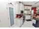White kitchen featuring stainless steel appliances, granite countertops, and a walk-in pantry at 2936 Grasslands Dr, Lakeland, FL 33803