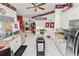 Open kitchen with granite countertops, stainless steel appliances, and view into adjacent rooms at 2936 Grasslands Dr, Lakeland, FL 33803