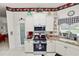 Bright kitchen featuring granite countertops, white cabinets, and decorative accents throughout at 2936 Grasslands Dr, Lakeland, FL 33803