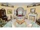 Comfortable living room with archway, neutral walls, fireplace and plenty of natural light at 2936 Grasslands Dr, Lakeland, FL 33803