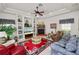 Spacious living room featuring fireplace, built-in shelving, and ample seating at 2936 Grasslands Dr, Lakeland, FL 33803