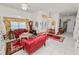 Bright living room with tile flooring, showcasing a sitting area with elegant furniture and a decorative doorway at 2936 Grasslands Dr, Lakeland, FL 33803