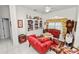 A well-decorated living room offering a comfortable seating arrangement, bookcase, and traditional furnishings at 2936 Grasslands Dr, Lakeland, FL 33803