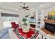 Bright living room with high tray ceilings, fireplace, and built-in shelving at 2936 Grasslands Dr, Lakeland, FL 33803