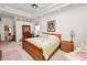 The main bedroom features a tray ceiling, soft carpet, and a doorway to the adjacent living area at 2936 Grasslands Dr, Lakeland, FL 33803