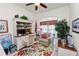 Home office with large built-in desk, a floral area rug, comfortable chair, and natural light at 2936 Grasslands Dr, Lakeland, FL 33803