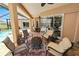 Spacious patio with a view of the pool, golf course, and tropical landscaping at 2936 Grasslands Dr, Lakeland, FL 33803