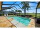 Inviting pool area featuring a spa, comfortable lounge chairs, and picturesque golf course views at 2936 Grasslands Dr, Lakeland, FL 33803