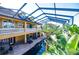 Elevated view of the home's exterior, showcasing the pool, greenery, and outdoor living spaces at 3020 Crews Lake Dr, Lakeland, FL 33813