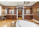 Spacious bathroom with dual vanities, a soaking tub, and elegant finishes at 3020 Crews Lake Dr, Lakeland, FL 33813