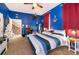 Nautical-themed bedroom with a blue and white striped comforter, desk, and nautical decor at 3020 Crews Lake Dr, Lakeland, FL 33813