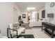 Minimalist bedroom features white walls and contemporary furniture, complemented by pops of black for a modern aesthetic at 3020 Crews Lake Dr, Lakeland, FL 33813