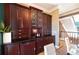 An elegant dining space featuring wooden cabinets with bar area and waterfall feature at 3020 Crews Lake Dr, Lakeland, FL 33813